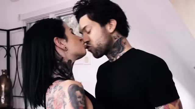 Tattooed babe Joana throats a big cock