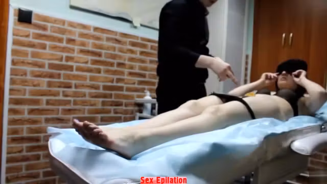 Professional master removes hair from girl's genitals