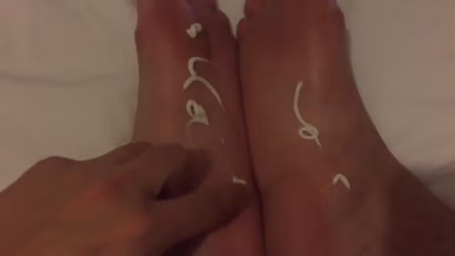 Rubbing lotion into my sexy feet