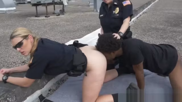 Redhead cop sucks a big black cock