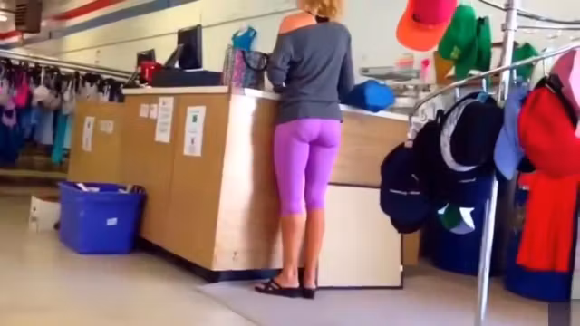 Blonde shopaholic in pink sweatpants gets her behind taped