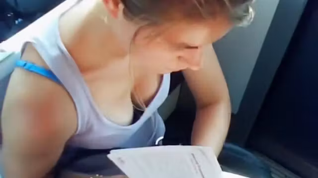 Great cleavage on a chick reading on the train