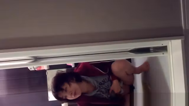 Asian fills glass of piss