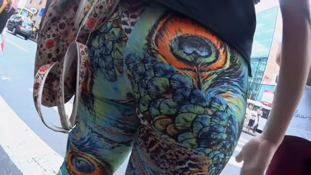 Big butt wiggles in peacock tights