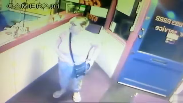 Blonde woman pisses right in front of the receptionist's desk