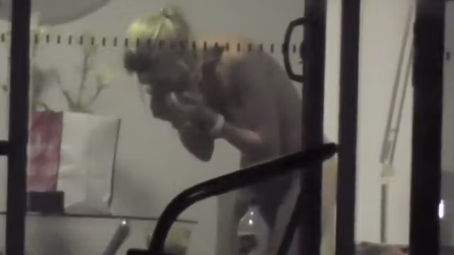 Saucy chickie gets caught on tape taking off her clothes