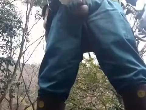 jerkoff Japanese powerlineman in uniform and rubber boots