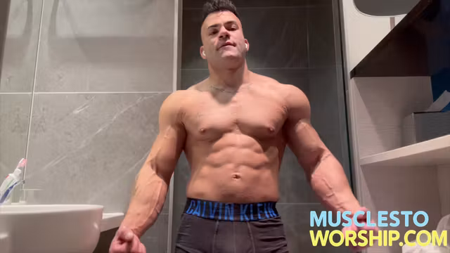 Young Alpha Bodybuilder Flexes Big Muscles