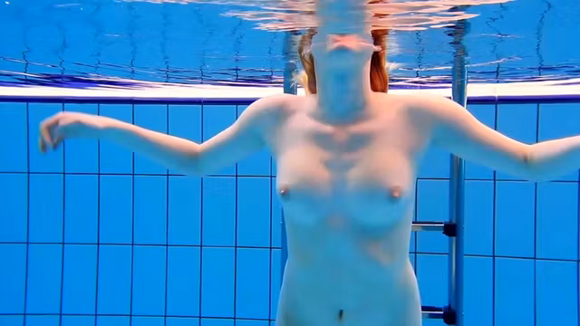 Big tits teen Lucie in the pool