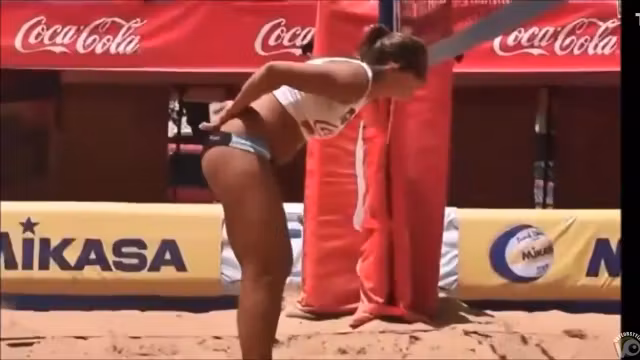 Beach volleyball girls with athletic asses in bikini bottoms