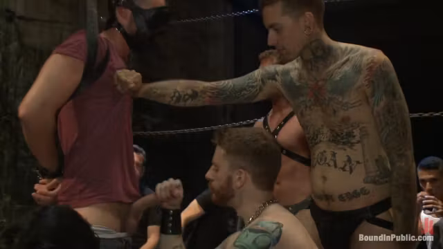 Bound in Public. Southern stud gets fucked and showered with cum in front of 100 men