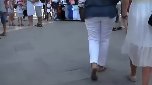 Cute girl in a white summer dress