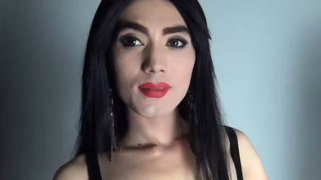 Trap beauty riding hard dildo in closeup