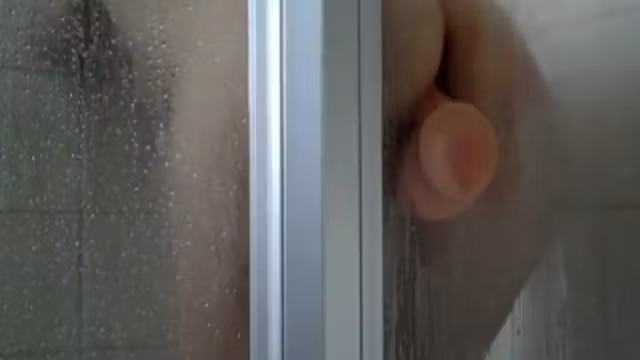 Peep her ride the sticky dildo in a shower