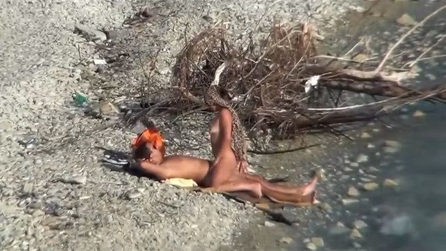Couple fucking on a public beach, while walking past people