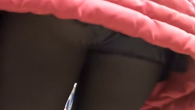 Peeping upskirt under a red jacket