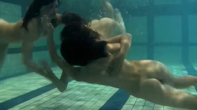 Sexy young teens swirl in the water