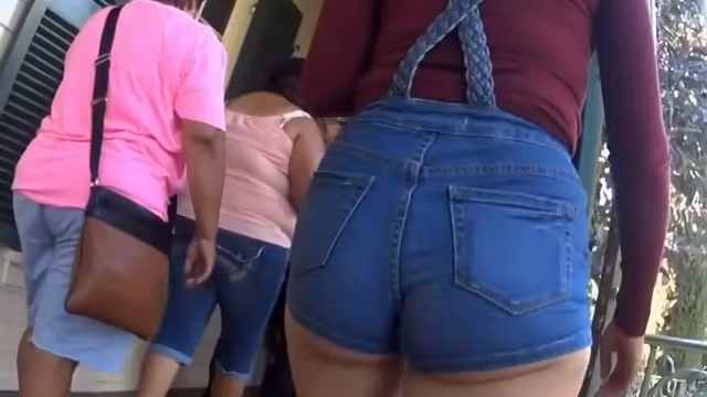 Ass cheeks fall out of denim shorts