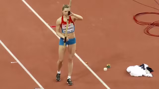 Pole vaulter with a nice butt competes in an event