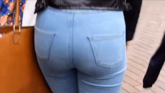 Candid blonde teen with sexy curves in jeans